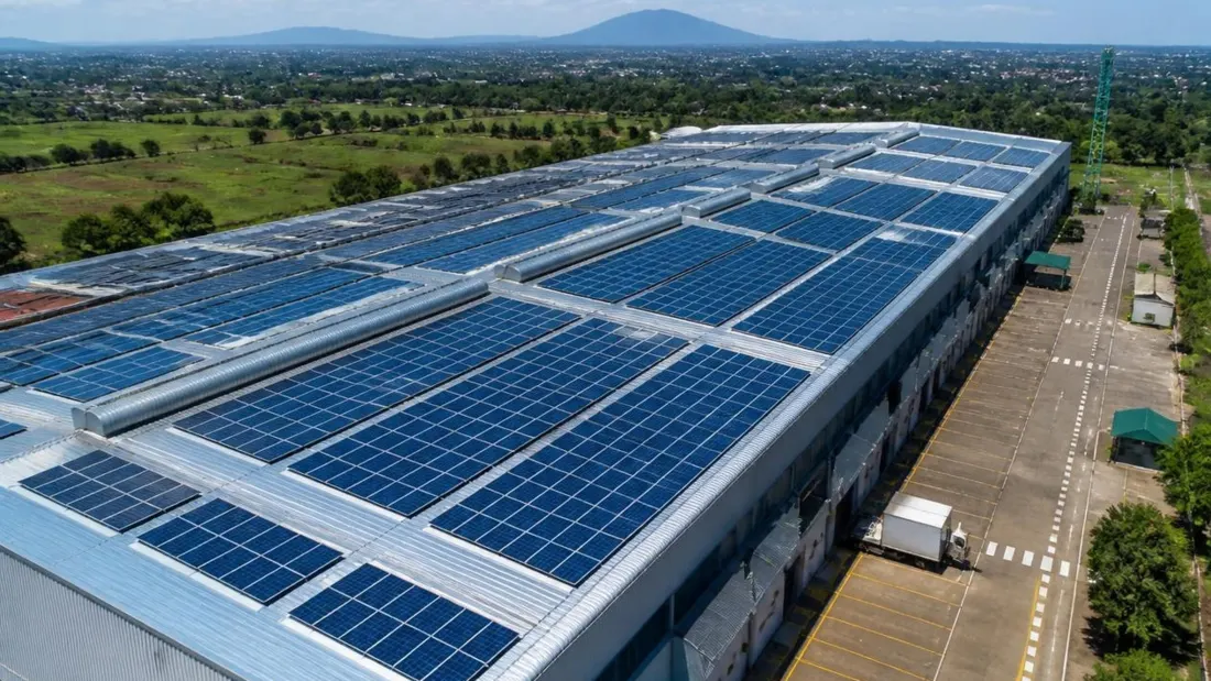 Factory roof fitted with grid-tied solar panels